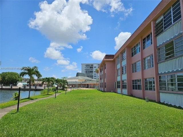 Landscaped grounds and lakeside walkway at Sixth Moorings Condominium